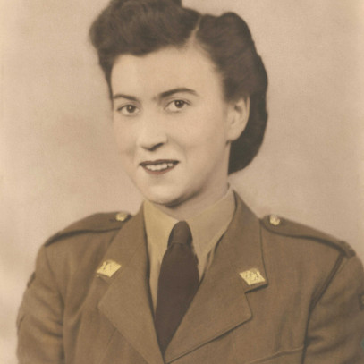 Sepia headshot of a young women in Canadian Women's Army Corps uniform.