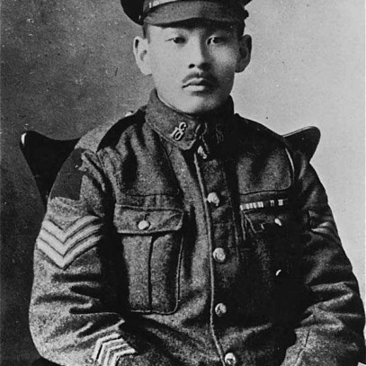 Black and white portrait photo of Masumi Mitsui. He wears his military uniform and various medals and decorations.