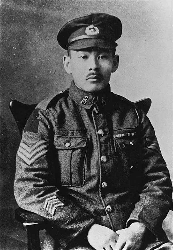 Black and white portrait photo of Masumi Mitsui. He wears his military uniform and various medals and decorations.